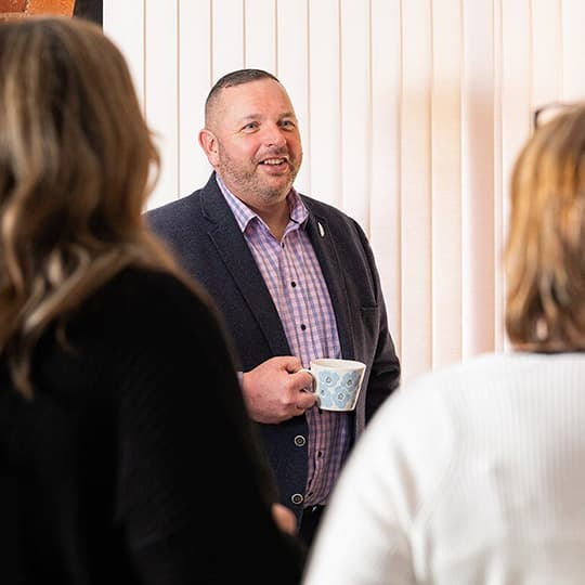 Business conference with people talking about retirement